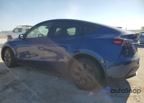 2025 Tesla Model Y z USA, uszkodzony, nr VIN 7SAYGAEEXSF256579